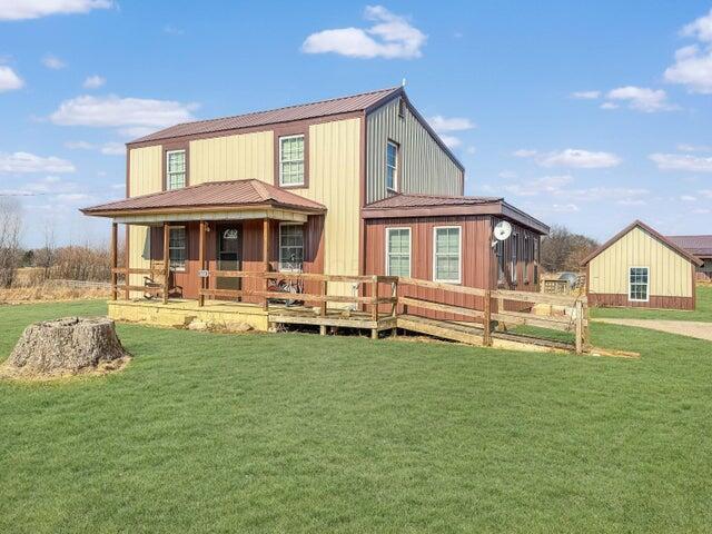 back of house with a yard
