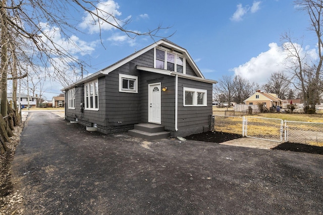 bungalow with a gate and fence