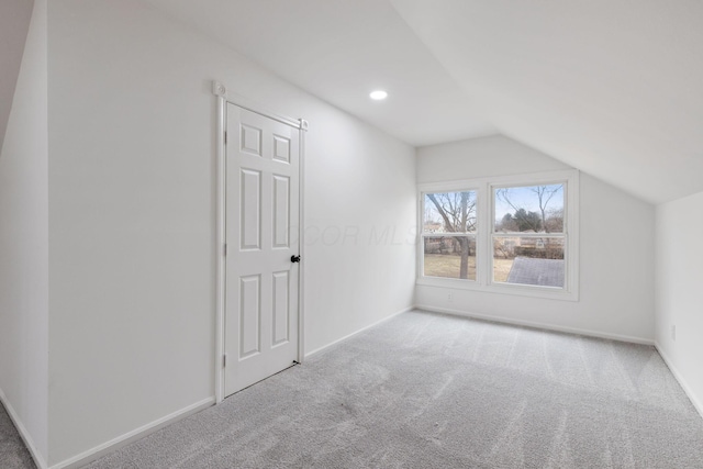 bonus room with lofted ceiling, baseboards, carpet, and recessed lighting