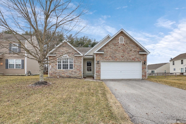 view of front facade with aphalt driveway, stone siding, fence, and a front lawn