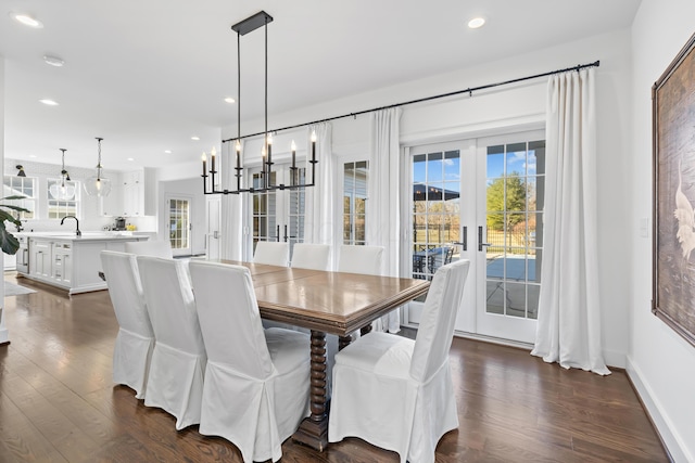 dining area featuring recessed lighting, baseboards, and dark wood finished floors