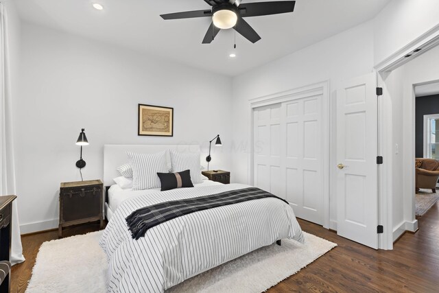 bedroom featuring ceiling fan, baseboards, recessed lighting, wood finished floors, and a closet
