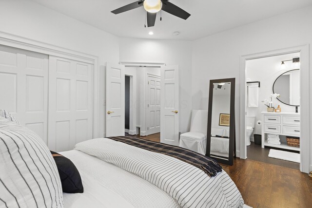 bedroom with dark wood finished floors, ensuite bath, recessed lighting, ceiling fan, and a closet