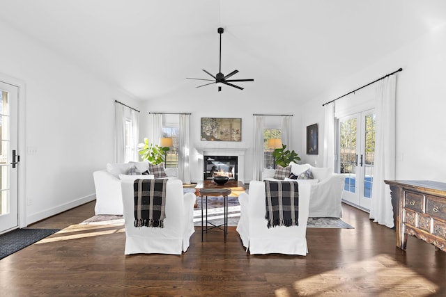 living area with wood finished floors, french doors, plenty of natural light, and ceiling fan