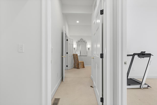 corridor with light carpet, visible vents, recessed lighting, and baseboards