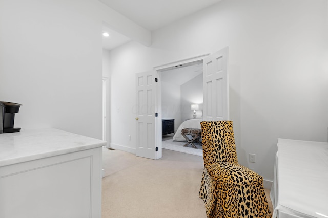 interior space featuring recessed lighting, baseboards, and light colored carpet
