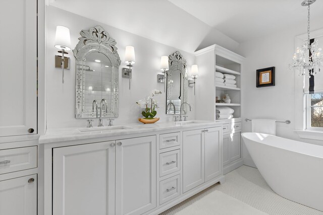 full bathroom featuring a sink, a soaking tub, double vanity, and a tile shower