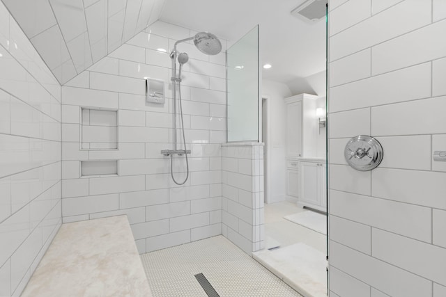 full bathroom featuring vanity and a walk in shower