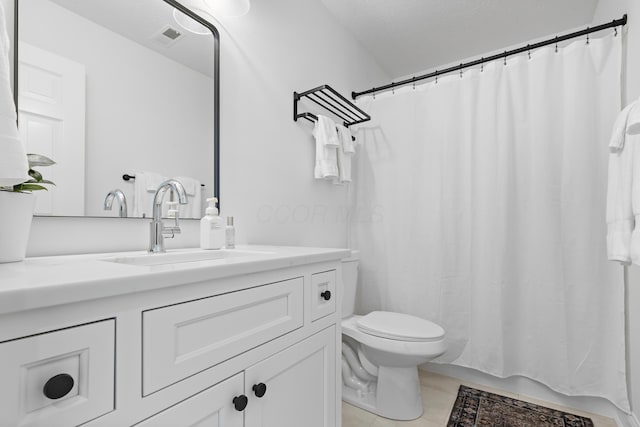 bathroom with visible vents, toilet, and vanity