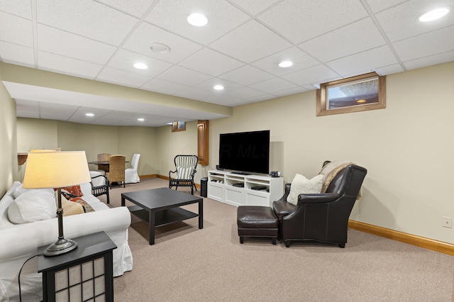 carpeted living room featuring recessed lighting, a paneled ceiling, and baseboards