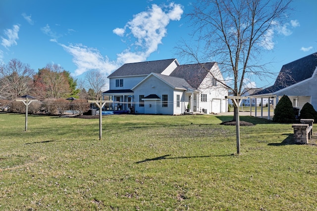 back of property with a yard