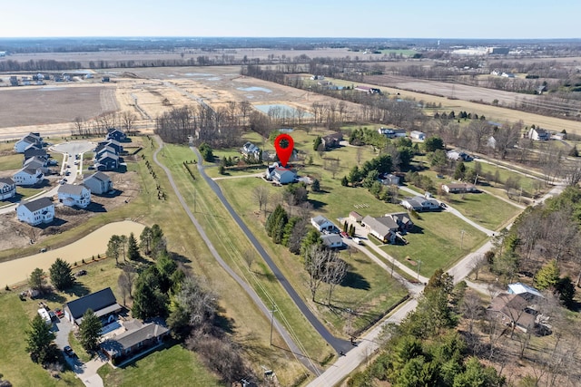 birds eye view of property with a rural view