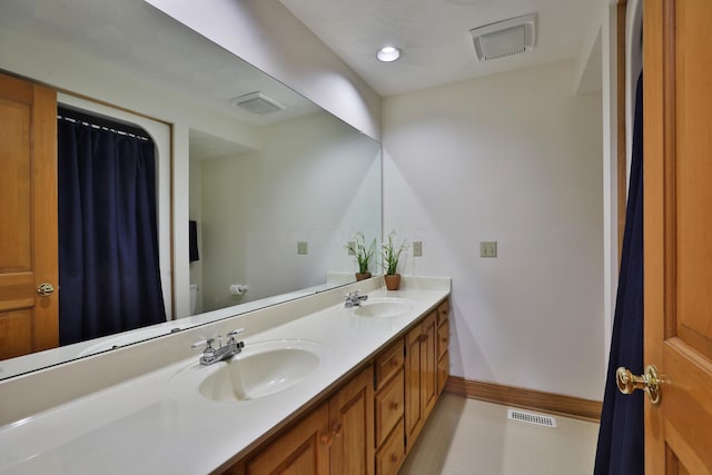 8871 Patterson Rd, Hilliard, OH 43026 - full bathroom with double vanity and toilet