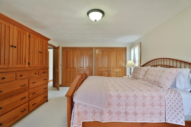 8871 Patterson Rd, Hilliard, OH 43026 - bedroom featuring multiple closets and light carpet