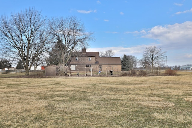 8871 Patterson Rd, Hilliard, OH 43026 - back of house with a chimney and an outdoor structure