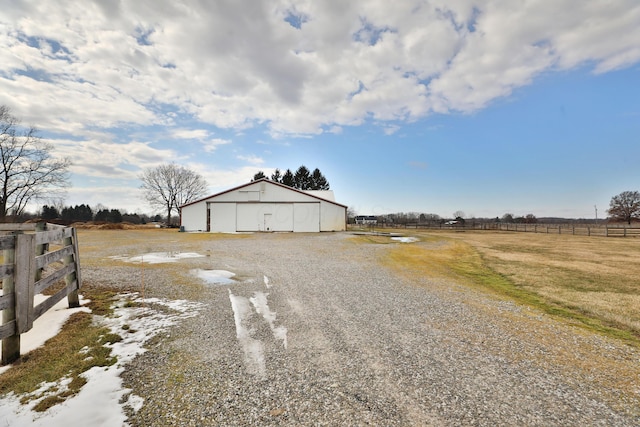 8871 Patterson Rd, Hilliard, OH 43026 - view of dirt / gravel driveway featuring a pole building and a view of countryside