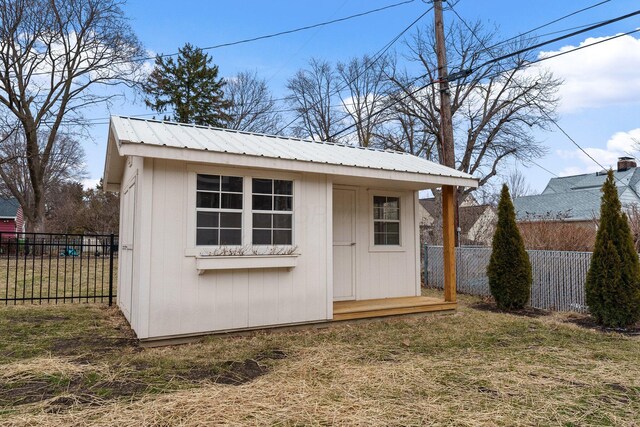 view of shed with fence