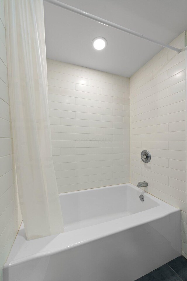 bathroom with tile patterned flooring, shower / bath combo with shower curtain, and recessed lighting