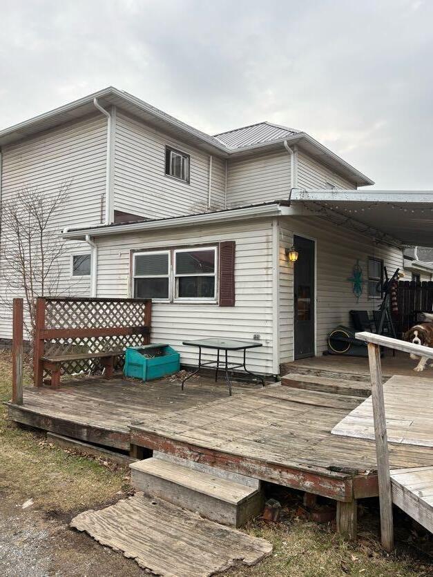 rear view of house with a wooden deck