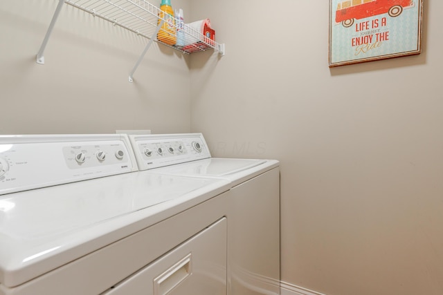 laundry room with washer and dryer and laundry area