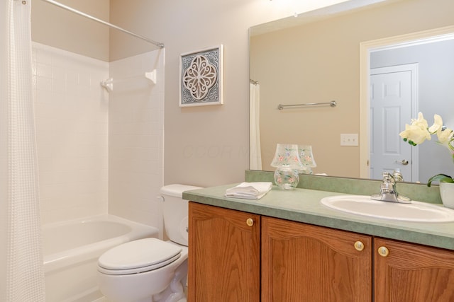 bathroom with toilet, shower / bath combo, and vanity