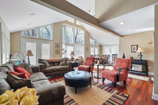 living area featuring baseboards, recessed lighting, french doors, wood finished floors, and high vaulted ceiling