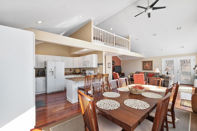 dining space featuring ceiling fan, recessed lighting, french doors, high vaulted ceiling, and dark wood-style flooring