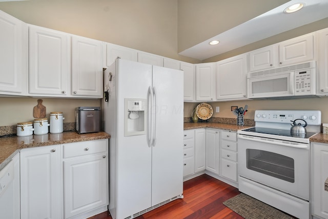 kitchen featuring recessed lighting, white appliances, dark wood-style flooring, and white cabinetry