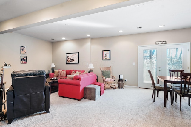 carpeted living area featuring recessed lighting, french doors, and baseboards