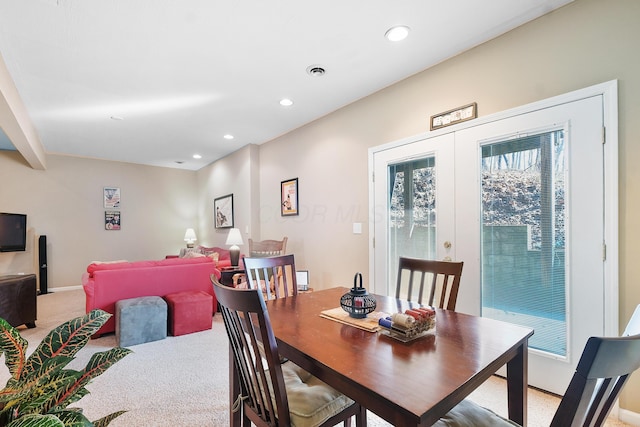 dining room with light carpet, visible vents, recessed lighting, and french doors