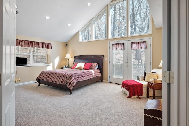 bedroom featuring french doors, multiple windows, carpet, and access to outside