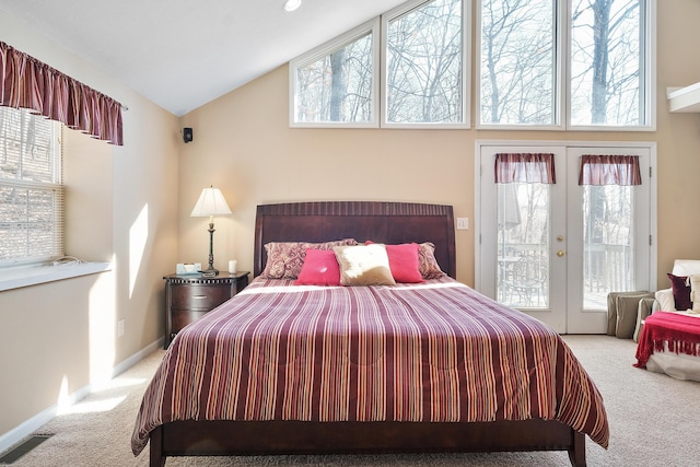 carpeted bedroom with access to exterior, multiple windows, french doors, and visible vents