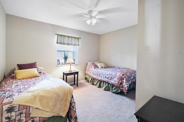 bedroom with ceiling fan and carpet floors