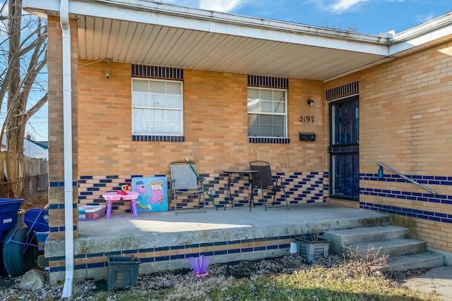 exterior space featuring brick siding