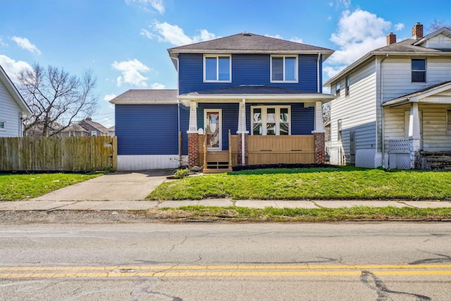 573 Frebis Ave, Columbus, OH 43206 - view of front of house featuring fence and a porch