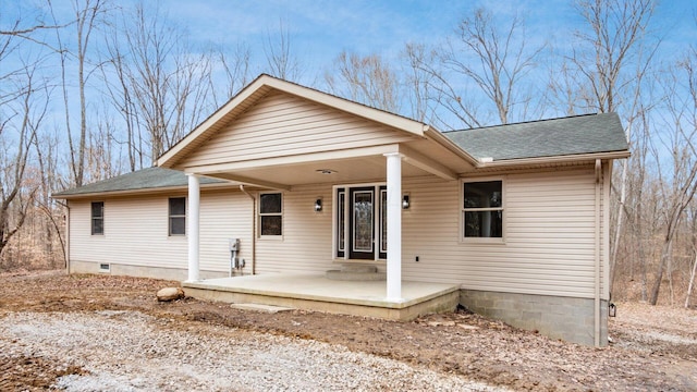 view of front of property with a shingled roof and a porch