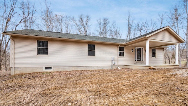 back of property featuring a porch