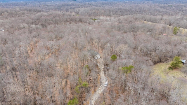 aerial view featuring a wooded view