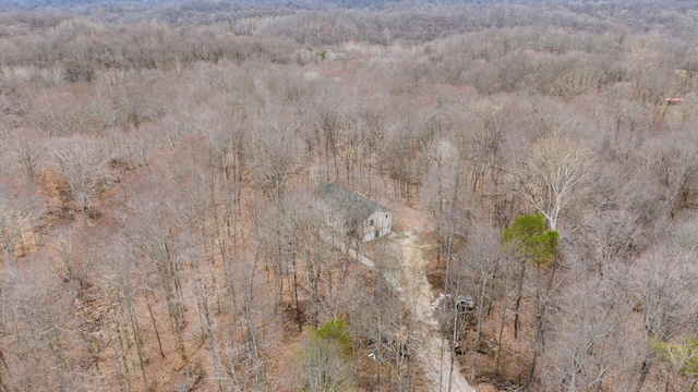 drone / aerial view featuring a view of trees