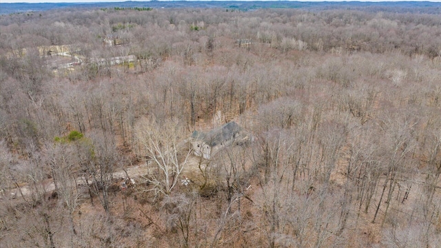 aerial view featuring a wooded view