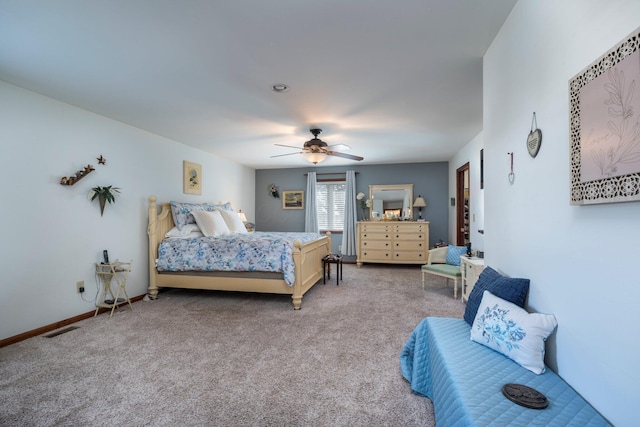 bedroom featuring a ceiling fan, visible vents, carpet floors, and baseboards