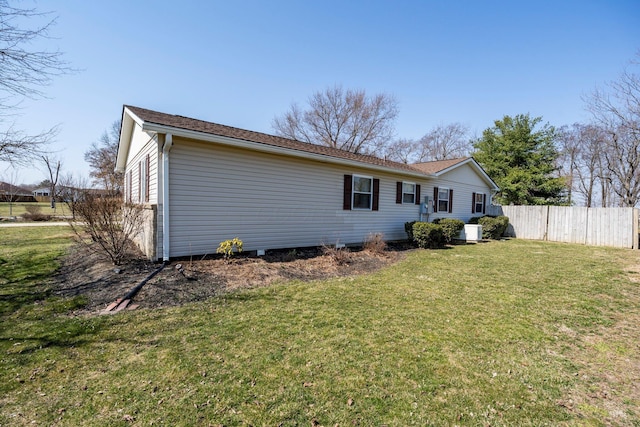 back of house with a lawn, central AC, and fence