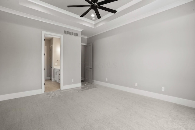 unfurnished bedroom with recessed lighting, a raised ceiling, light colored carpet, visible vents, and baseboards