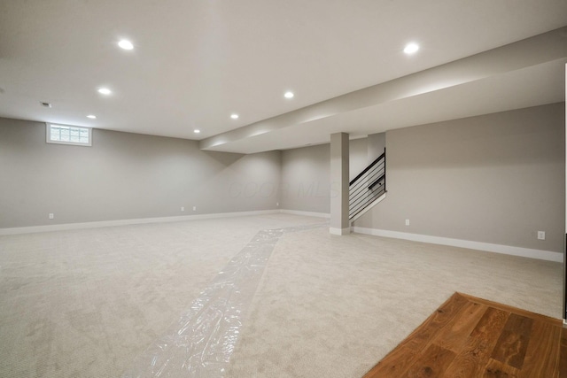 basement with stairs, baseboards, and recessed lighting