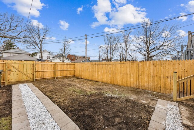 view of yard with a gate and fence