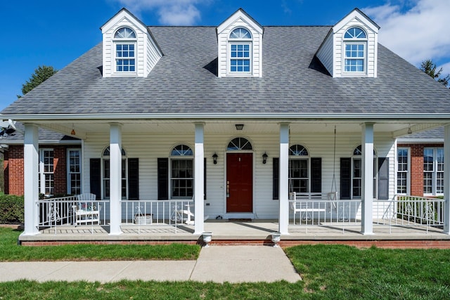 view of front of house featuring a porch and roof with shingles