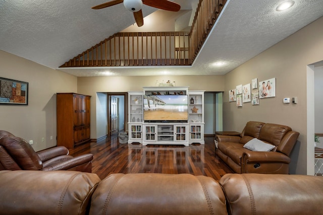living room featuring high vaulted ceiling, baseboards, a textured ceiling, a ceiling fan, and wood finished floors