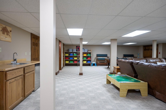 playroom with a sink, a paneled ceiling, and light carpet