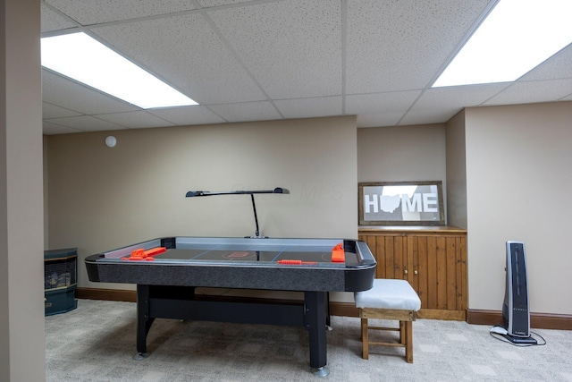 rec room featuring carpet flooring, baseboards, and a paneled ceiling