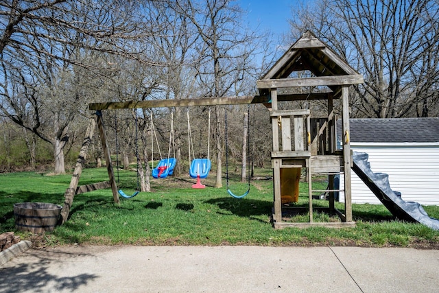 view of playground with an outdoor structure and a yard